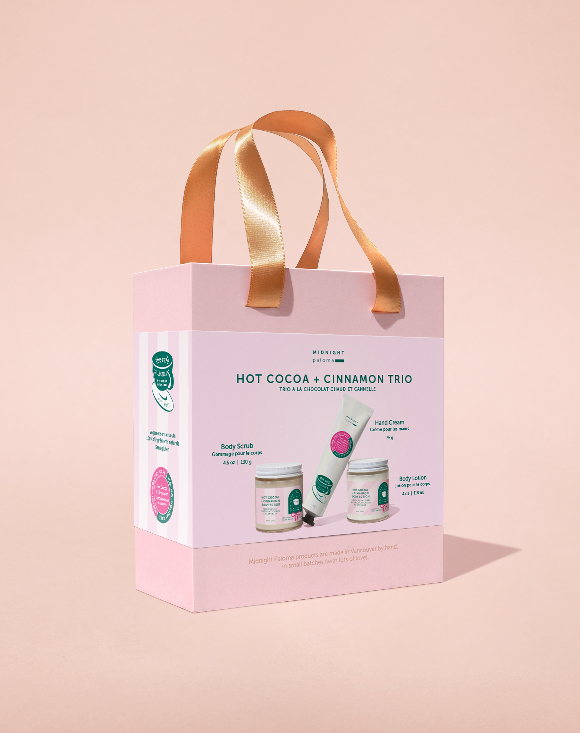 Gift set packaging with 'Hot Cocoa + Cinnamon Trio' on a beige background